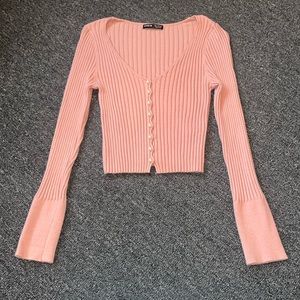 Women’s pink sweater size Small with pearl buttons